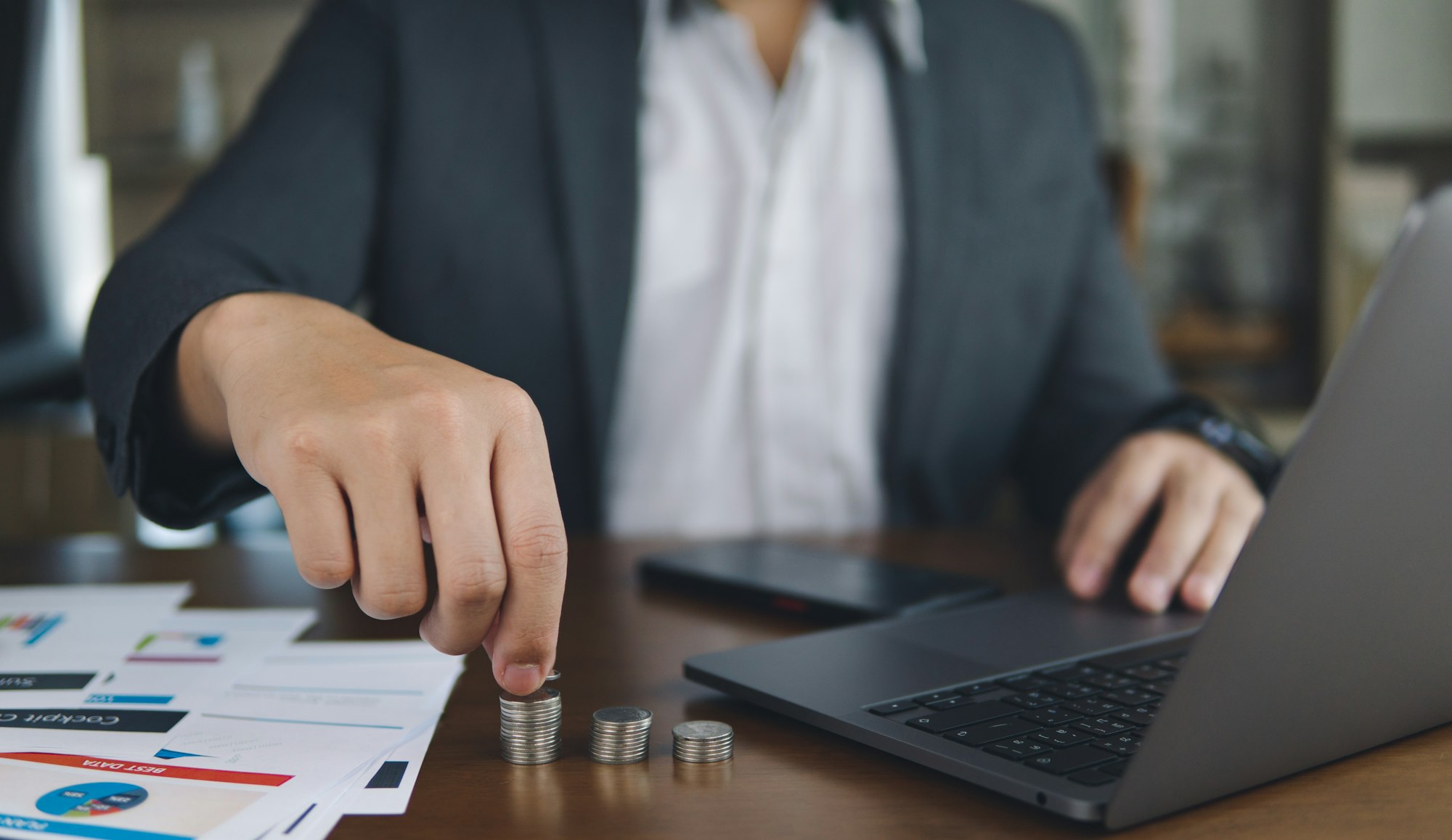 Business people holding money coin and stack coin, concept of money saving, business money